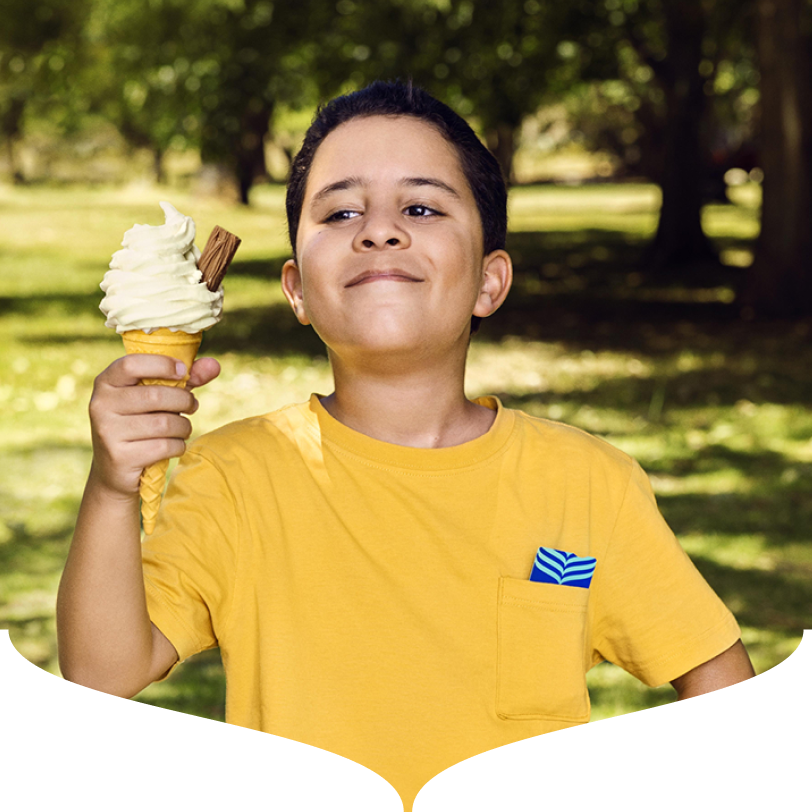 Image of a boy holding an ice cream with a Bank of Ireland debit card in his pocket.