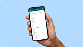 A hand holding a smartphone displaying Bank of Ireland 365.